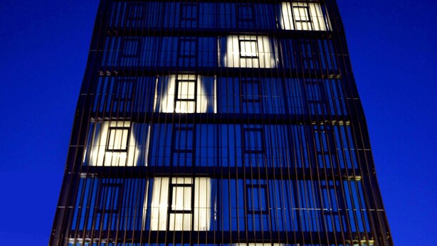 A modern building with a glass facade and a series of vertical lines. - All Inn Hotel (Istanbul)