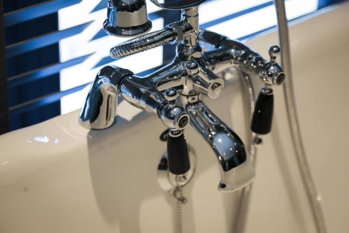 signature suite | bathroom | free toiletries, hair dryer, slippers, towels