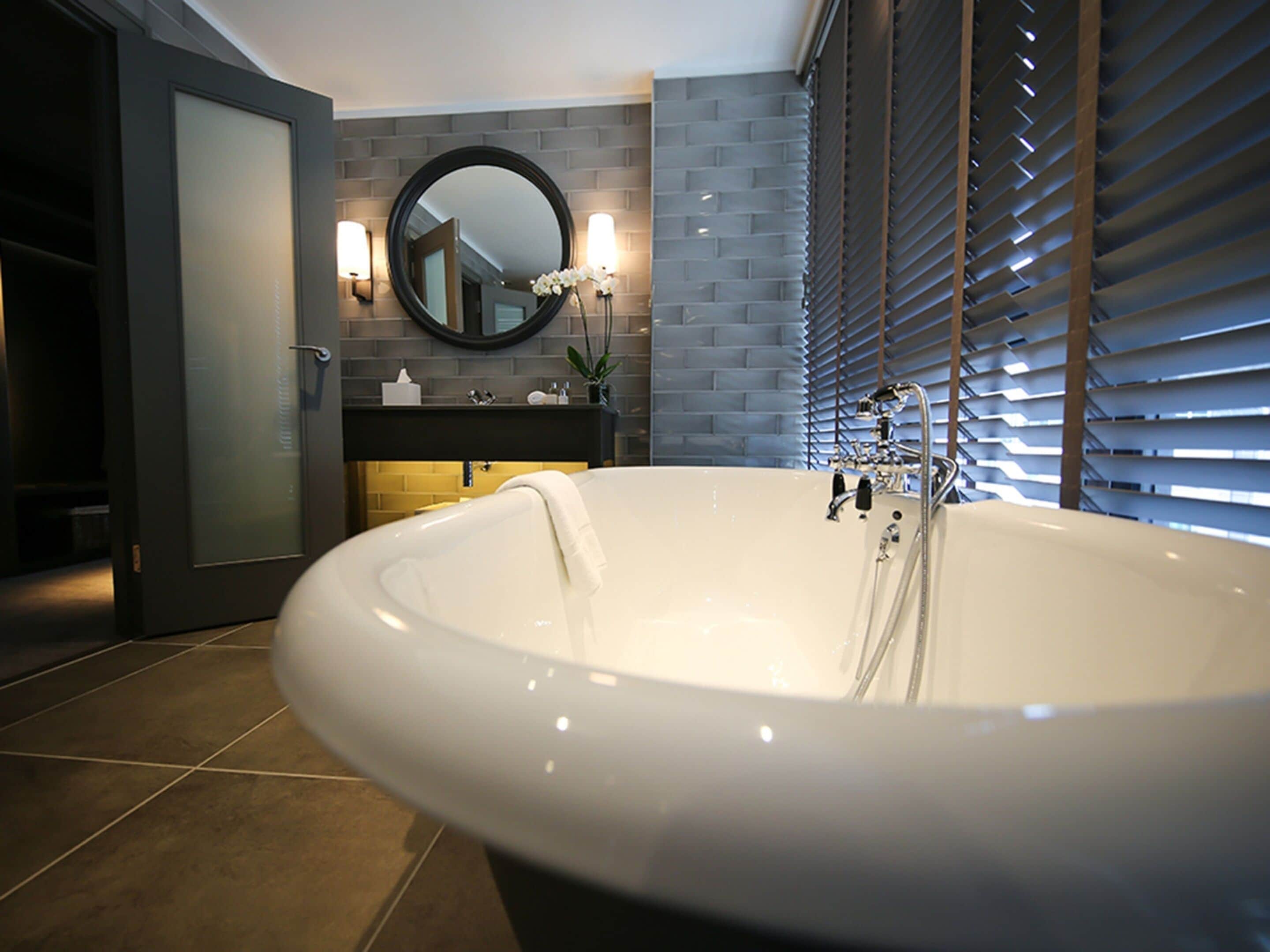 signature suite | bathroom | free toiletries, hair dryer, slippers, towels