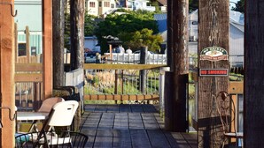 A wooden pergola with a sign reading "Holland Vineyard Premium Wines & Ries." - The La Conner Inn (La Conner)