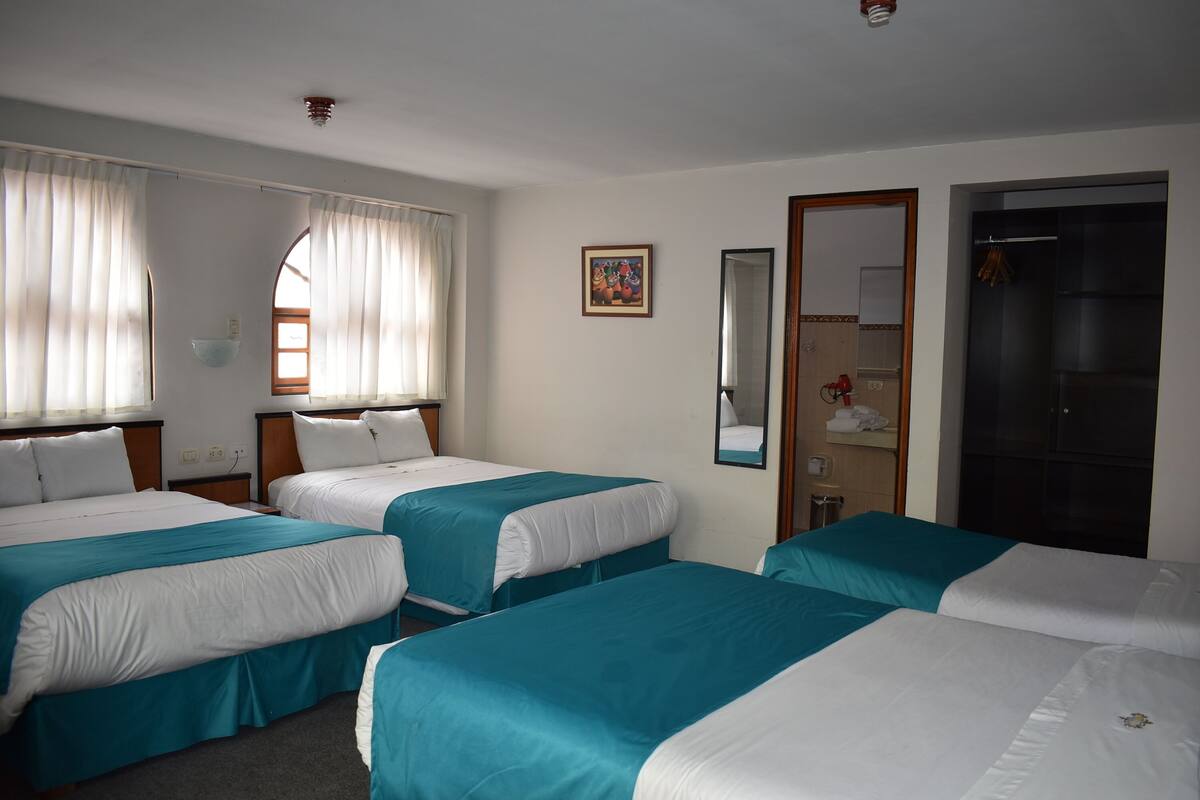 Standard Quadruple Room, Private Bathroom, Garden View | In-room safe, desk, blackout drapes, WiFi (free)