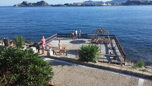 A wooden pier with a thatched roof, overlooking a calm sea. - Corfu Anastasia (Corfu)