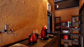 Full-size fridge, microwave, stovetop, coffee/tea maker