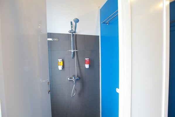 A modern bathroom with a shower, a toilet, and a sink. - Four Rivers B&B Mandalay - Hostel (Mandalay)