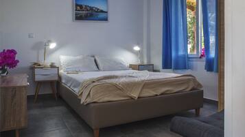 Apartment, 2 Bedrooms, Sea View | 2 bedrooms, in-room safe, soundproofing, iron/ironing board