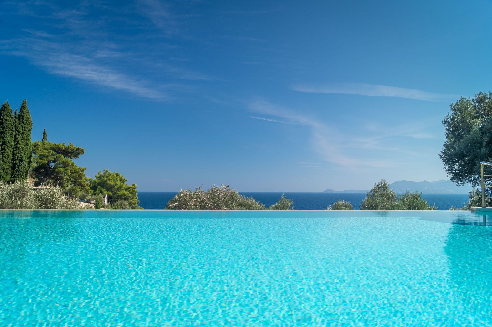outdoor pool, an infinity pool, pool loungers