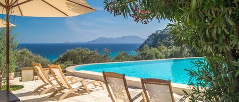 Outdoor pool, an infinity pool, sun loungers