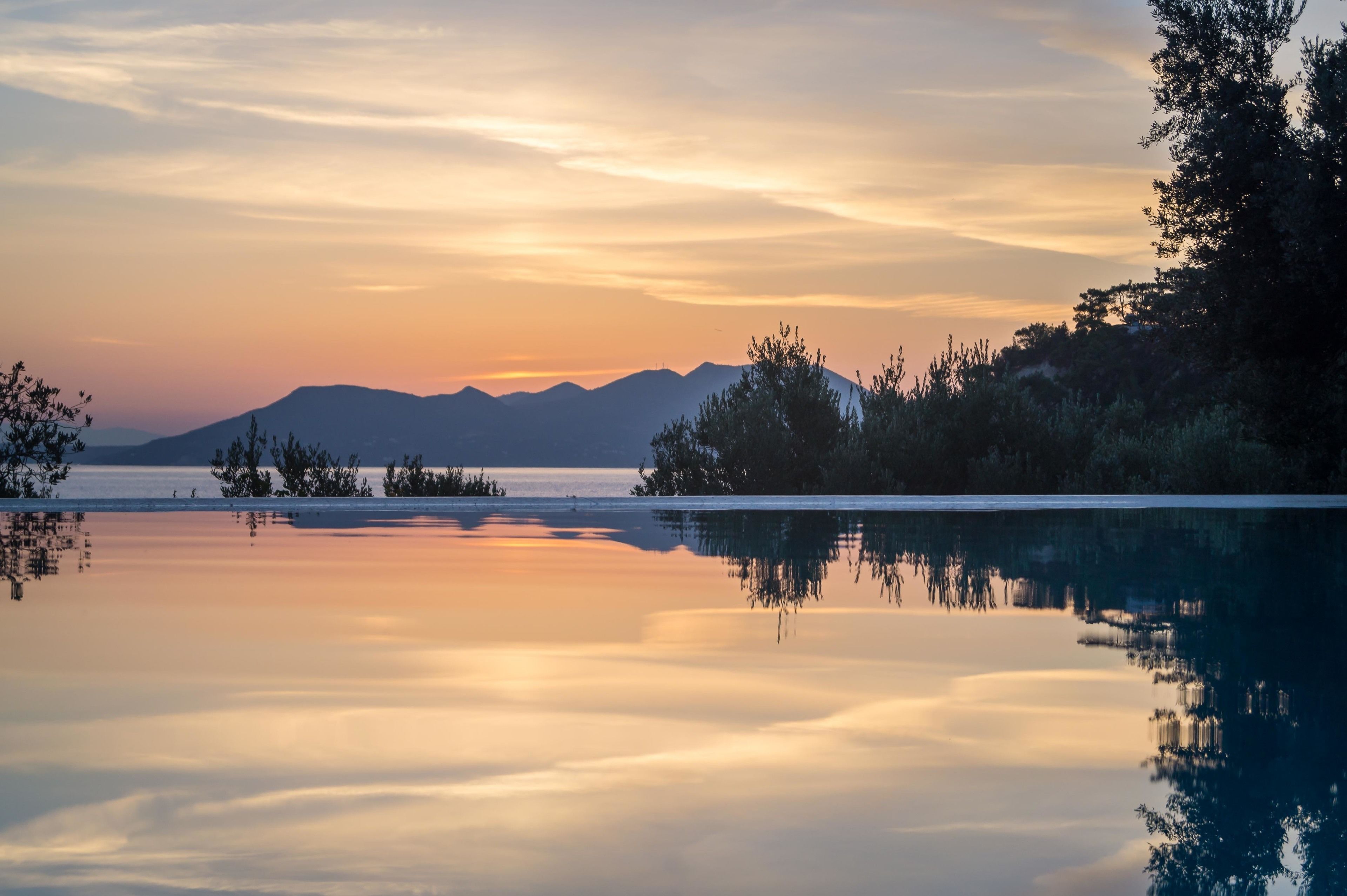 outdoor pool, an infinity pool, pool loungers