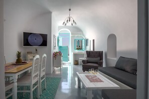 Traditional House | Living area | 32-inch flat-screen TV with satellite channels, LCD TV -  Cave Agapi Oia (Santorini)