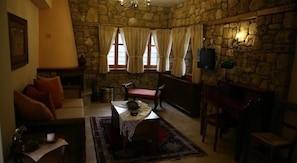 Junior Suite | Living room | 22-inch plasma TV with satellite channels, TV