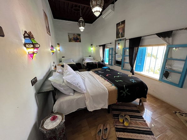 Classic Quadruple Room, 1 Bedroom, Private Bathroom, Mountain View | Egyptian cotton sheets, individually decorated, desk, laptop workspace