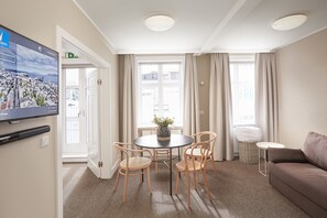 Premium bedding, blackout curtains, soundproofing, iron/ironing board