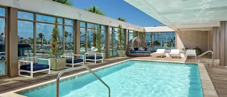 Outdoor pool, open 7:00 AM to 10:00 PM, free cabanas, sun loungers