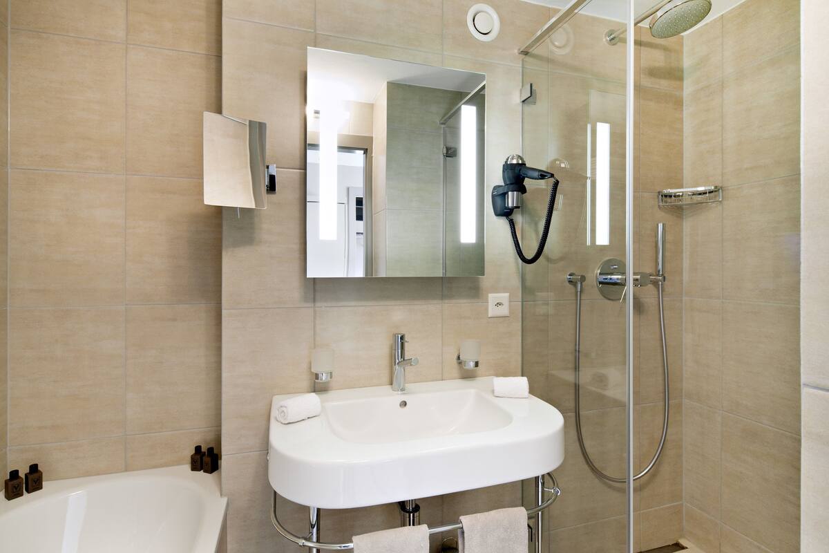 combined shower/bathtub, free toiletries, hair dryer, bathrobes