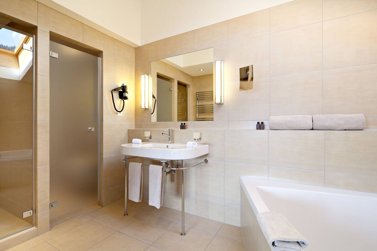 panoramic suite, 3 bedrooms, balcony, mezzanine | bathroom | combined shower/bathtub, free toiletries, hair dryer, bathrobes