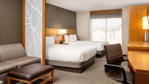 A hotel room with two beds, a sofa, a desk, and a chair. - Hyatt Place Edmonton-West (Edmonton)