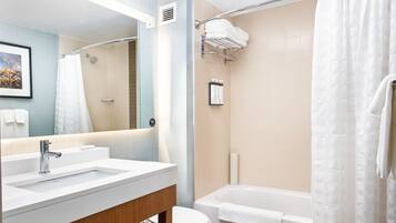 Designer toiletries, hair dryer, towels