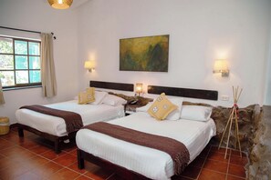 A hotel room with two beds, a large window, and a painting on the wall. - Andean Wings Valley (Urubamba)