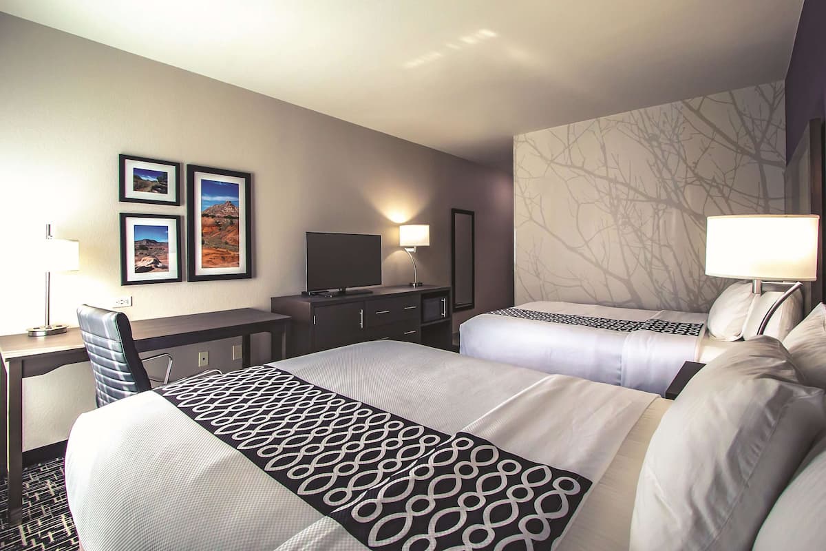 Room, 2 Queen Beds, Non Smoking | Pillowtop beds, desk, iron/ironing board, free cribs/infant beds