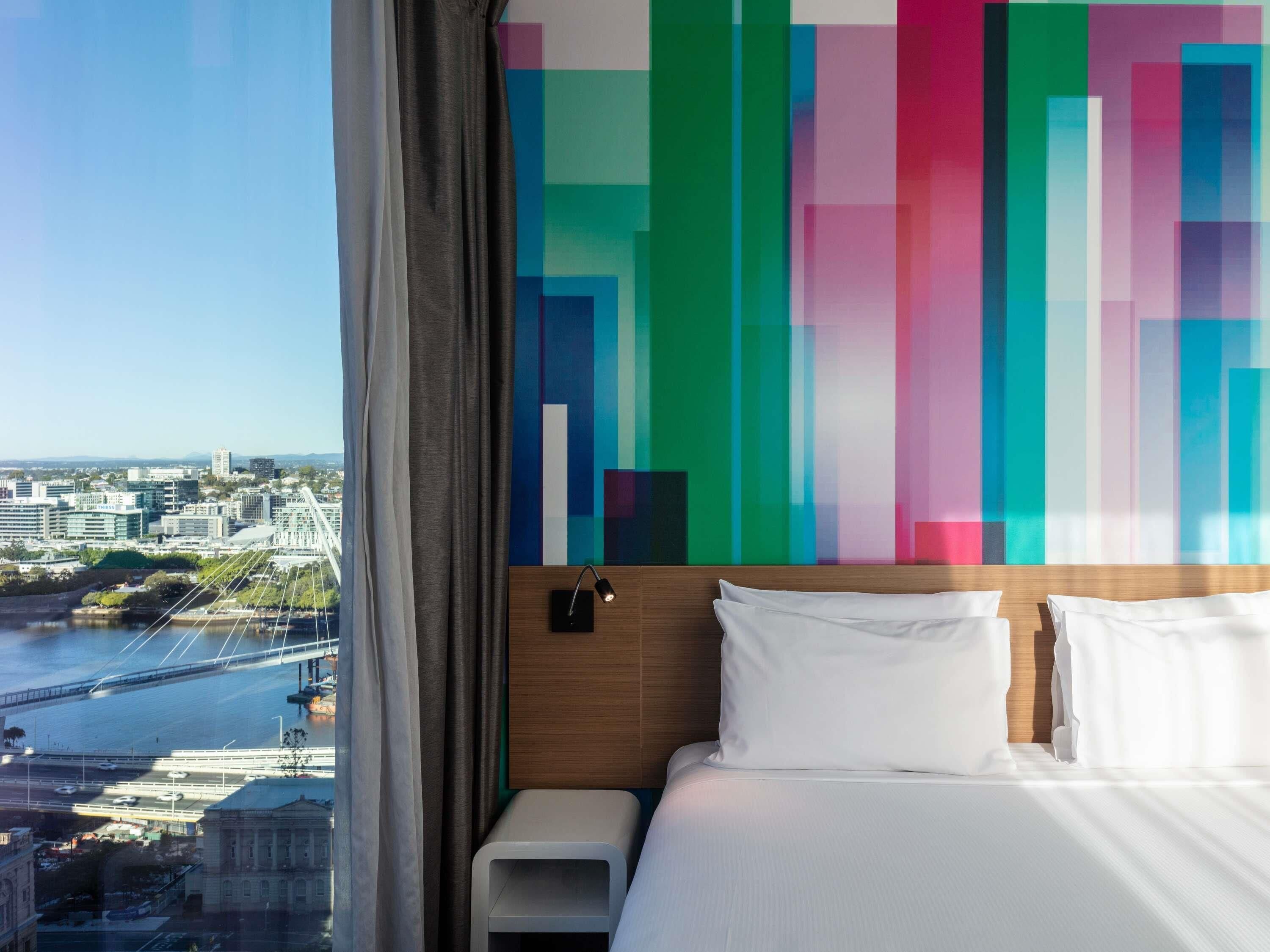 Deluxe Room, 1 King Bed, City View, Corner | In-room safe, desk, soundproofing, iron/ironing board