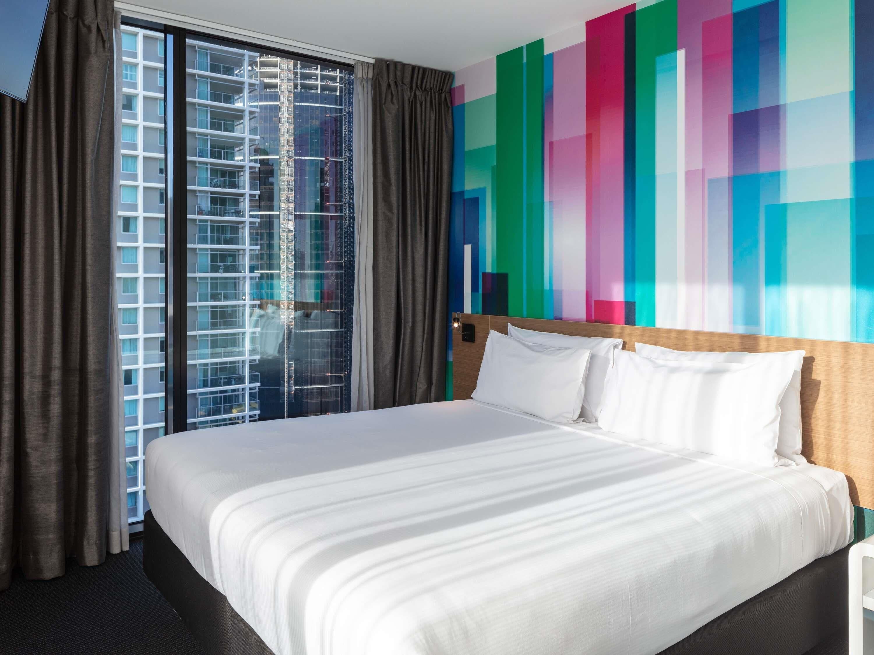 Deluxe Room, 1 King Bed, City View, Corner | In-room safe, desk, soundproofing, iron/ironing board