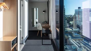 Deluxe Room, 1 King Bed, City View, Corner | In-room safe, desk, soundproofing, iron/ironing board