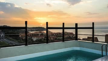 Outdoor pool, open 9:00 AM to 10:00 PM, pool loungers