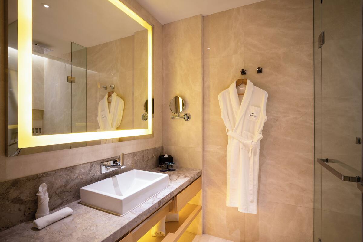 eco-friendly toiletries, hair dryer, bathrobes, slippers