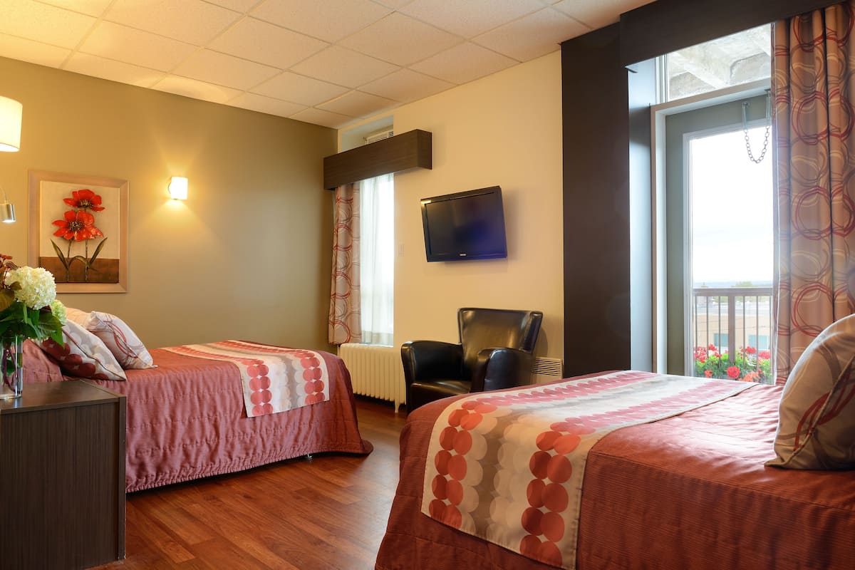 room, 2 queen beds | desk, soundproofing, iron/ironing board, free cots/infant beds