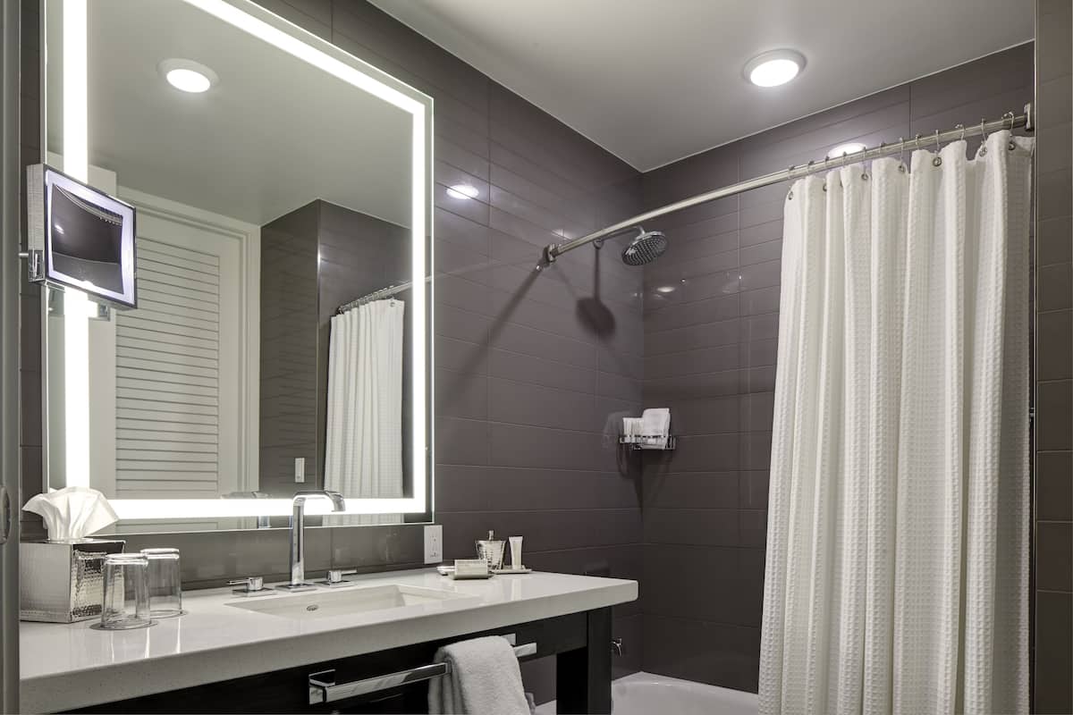 Double King Guest Room | Bathroom | Designer toiletries, hair dryer, bathrobes, slippers
