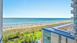 A hotel with a view of a beach and ocean. - Beach Colony Resort by Elliott Beach Rentals (Myrtle Beach)