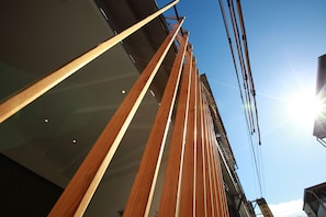 A building with wooden beams and a clear sky.