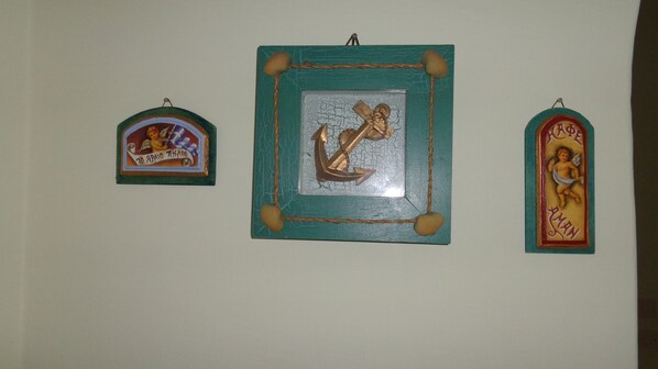 Three religious-themed wall decorations.