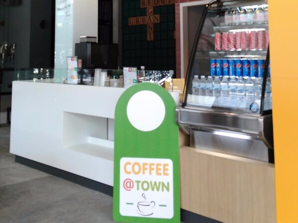 A coffee station with a sign that reads "COFFEE @ TOWN". - Bed@Town Hostel (Bangkok)