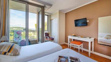 Twin Room | 1 bedroom, in-room safe, desk, blackout drapes