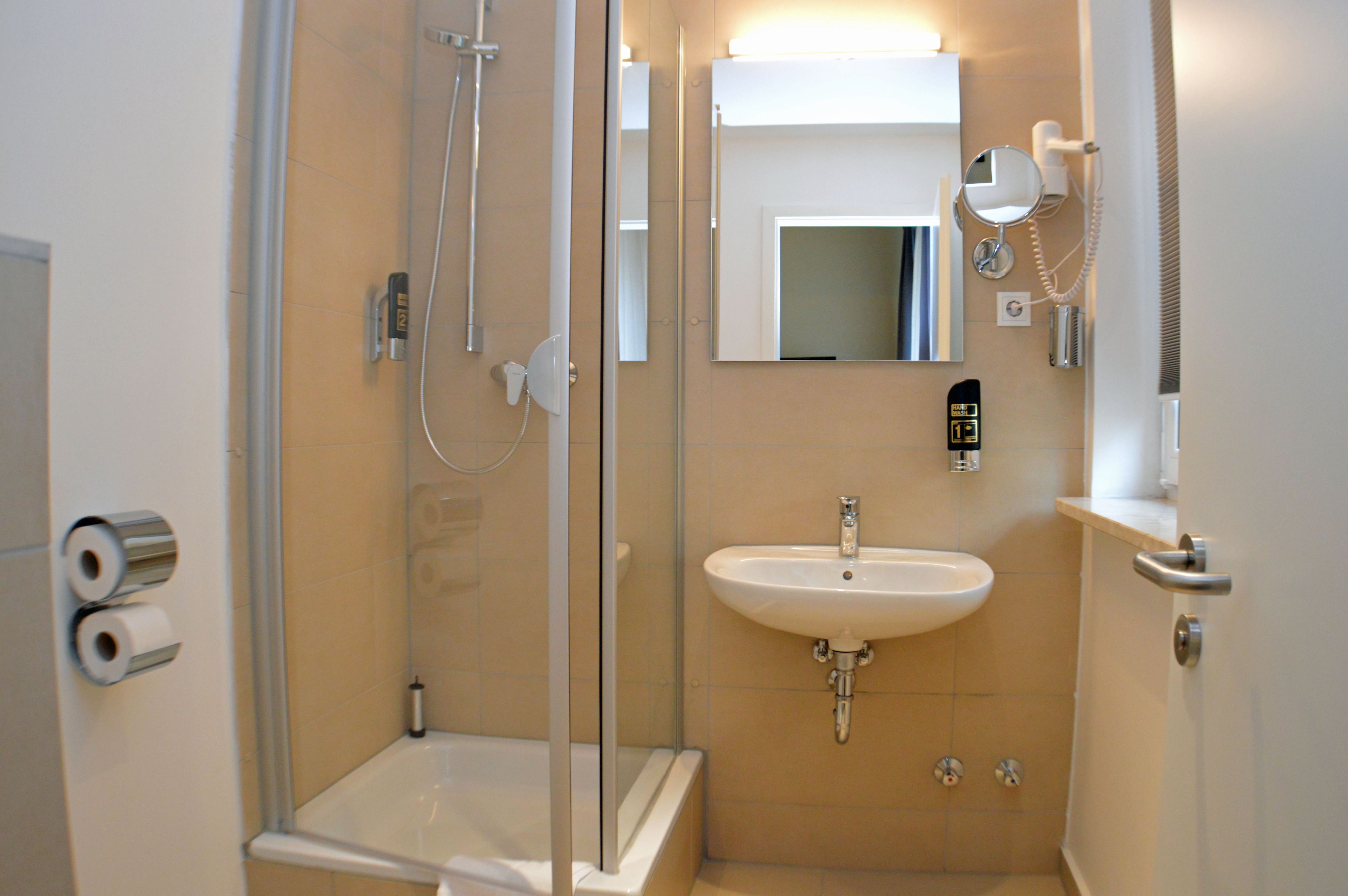 shower, free toiletries, hair dryer, towels