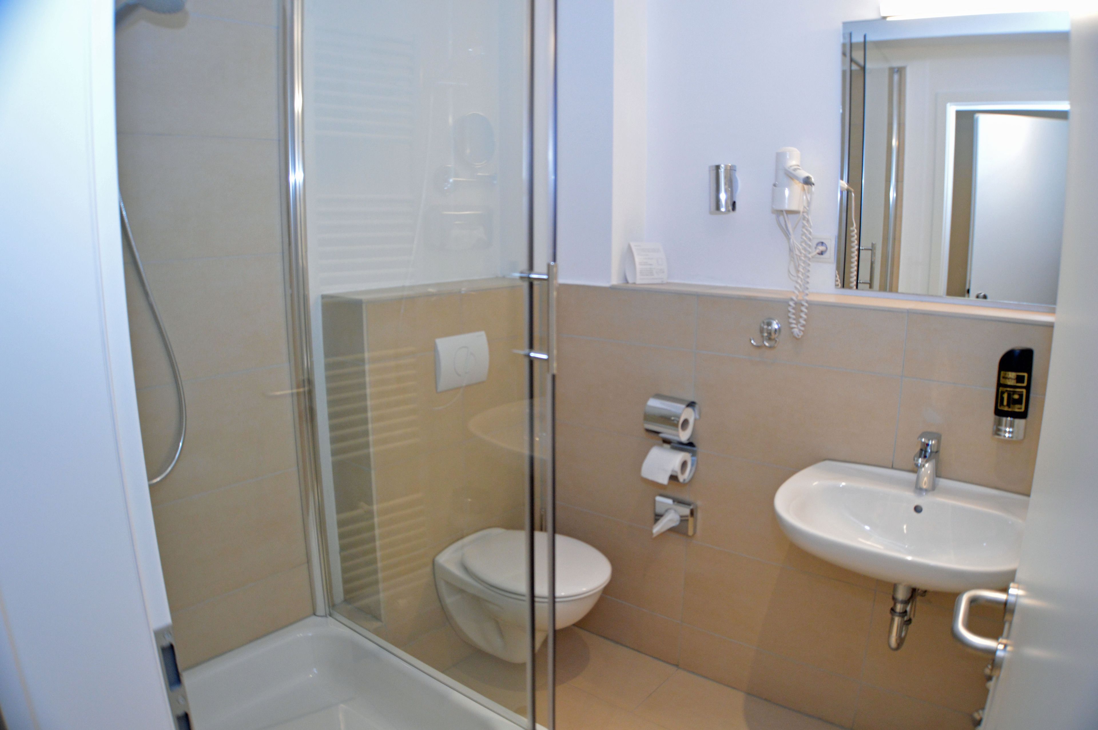 shower, free toiletries, hair dryer, towels