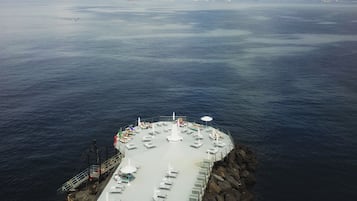 Private beach, black sand, sun loungers, beach towels