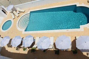 Outdoor pool, open 9:00 AM to 7:00 PM, pool loungers