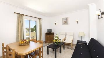 Apartment, 1 Bedroom | Living area | Flat-screen TV