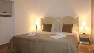 Desk, blackout curtains, free cots/infant beds, bed sheets