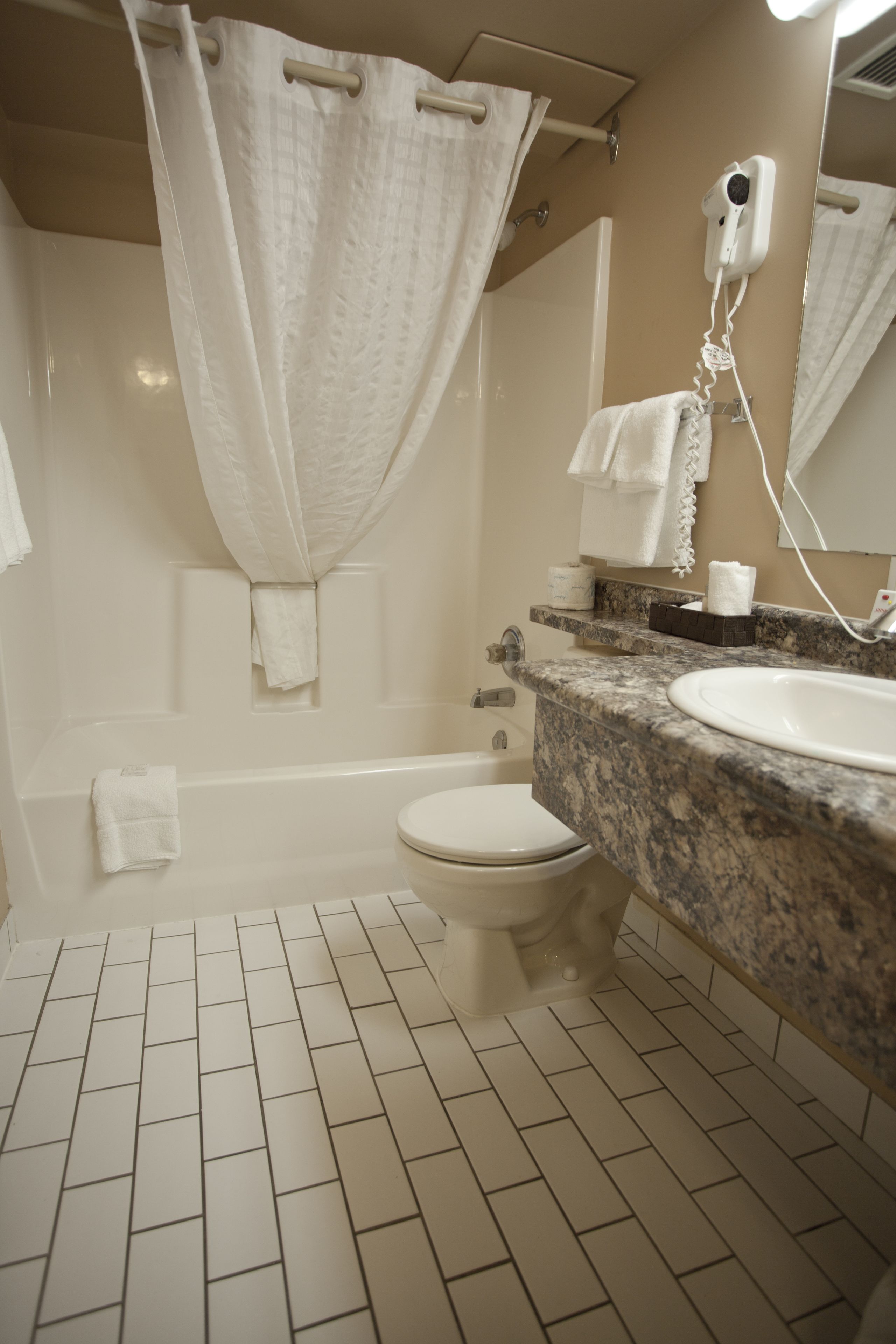 room, 2 queen beds | bathroom | combined shower/bathtub, free toiletries, towels