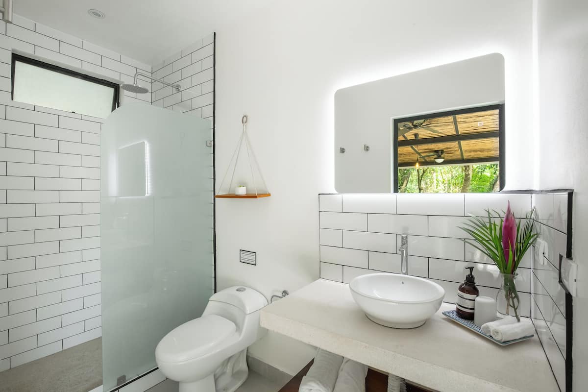 comfort apartment, 1 queen bed | bathroom | shower, hair dryer, towels