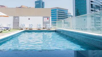 Outdoor pool, open 8:00 AM to 8:00 PM, pool umbrellas, sun loungers