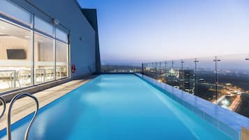Outdoor pool, open 7 AM to 7 PM, pool umbrellas, pool loungers