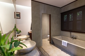 Deep soaking tub, rainfall showerhead, free toiletries, hair dryer