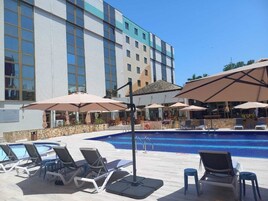 Outdoor pool, open 9:00 AM to 6:00 PM, pool loungers