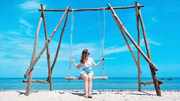 On the beach, sun-loungers, beach umbrellas