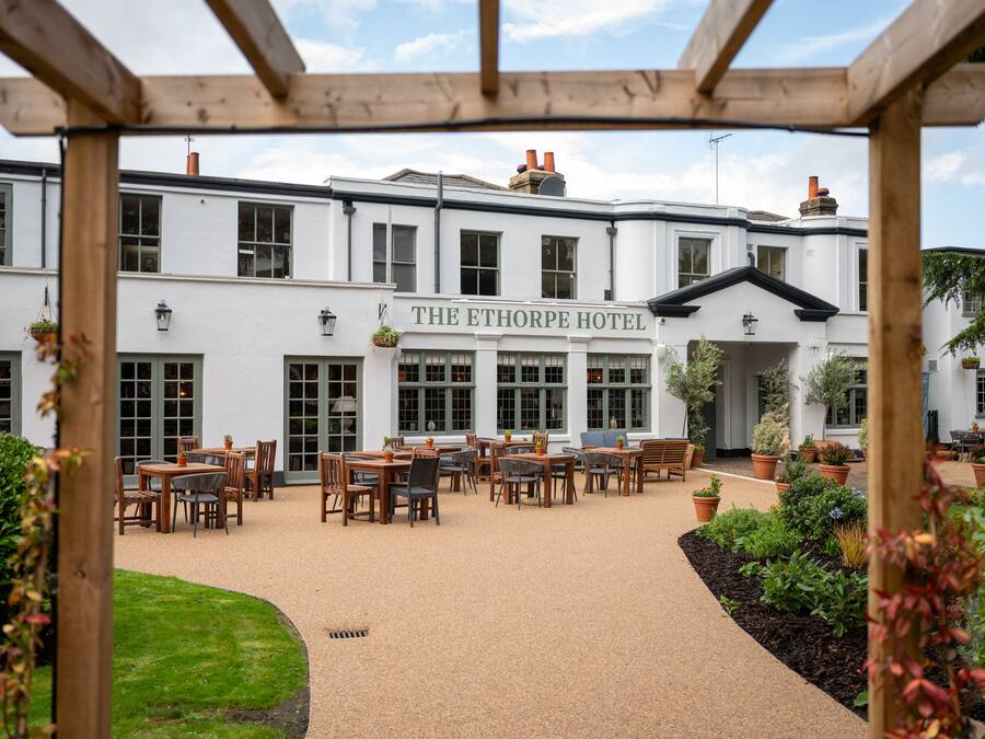 The Ethorpe Hotel with outdoor seating and a garden area.
