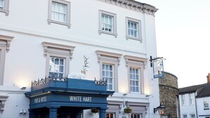 A historic building with a sign reading "WHITE HART PUB & HOTEL". - The White Hart Hotel by Greene King Inns (Buckingham)